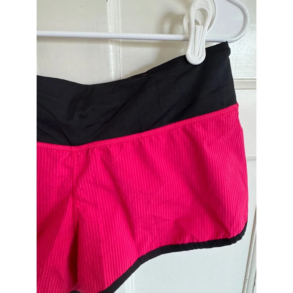 Lululemon pink & black shorts size 4.